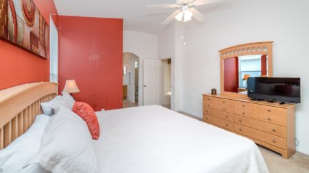 Outward view of the master bedroom with mirror and TV.