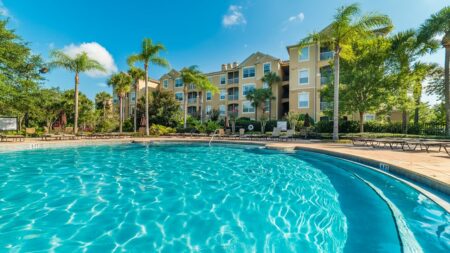 Stunning pool images with condos and blue sky in distance